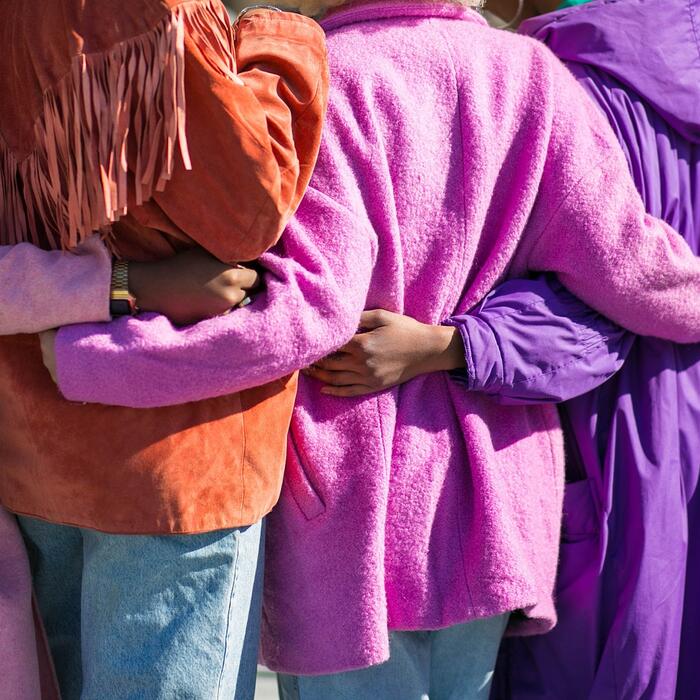 Four friends with their arms around each other